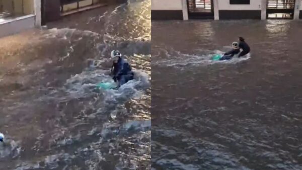 Una donna sfida la furia dell'acqua per salvare un motociclista | Scopri chi è il vero eroe di Catania!